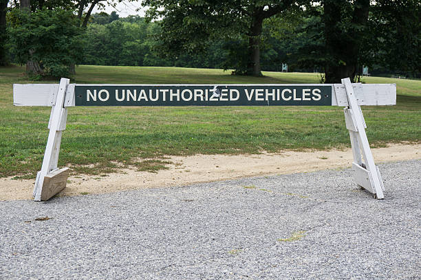 istock No unauthorized vehicles roadblock at park 591997290