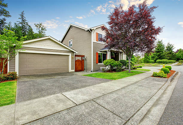istock House exterior with siding trim, garage and concrete walkway 591998446