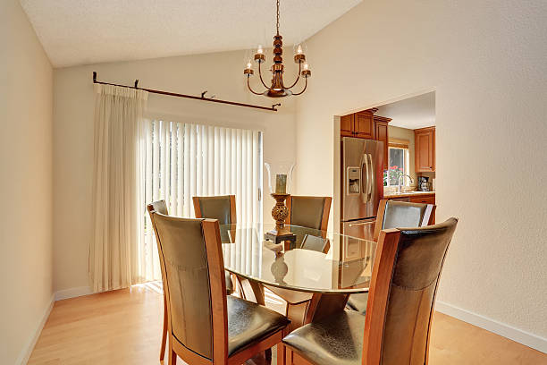 istock Dining room with table set. Glass table and leather chairs. 591998932