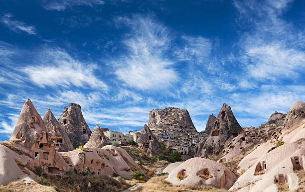 istock Uchisar castle and unique geological formations in Cappadocia, T 591999250