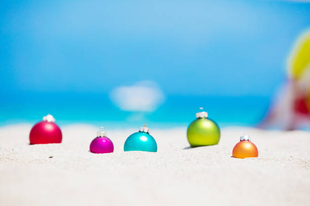 Christmas concept: Christmas baubles lying on a tropical beach. XXXL size image. Image taken with Canon EOS 5Ds and EF 70-200mm USM L 2,8. 