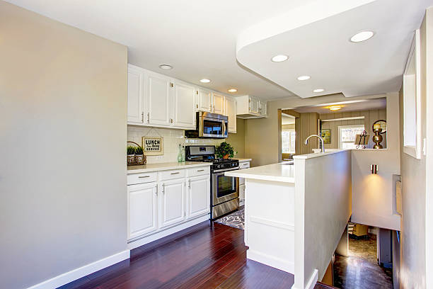 istock Classic American kitchen room with white cabinets and hardwood floor 591999862