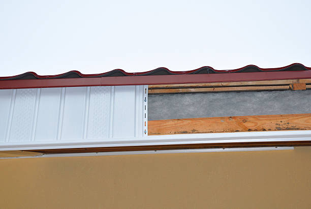 istock Close up on  Soffit and Fascia Installation. 592001162