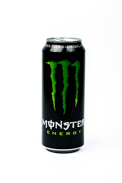 lata de monster energy drink. aislado sobre fondo blanco - editorial product shot food vertical fotografías e imágenes de stock