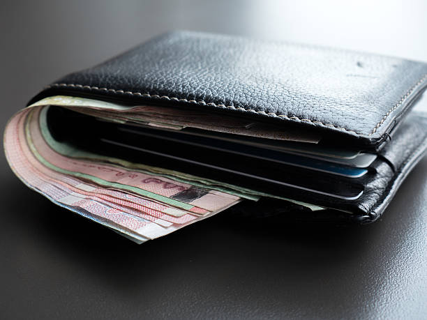 istock Money in men black leather wallet 592005176