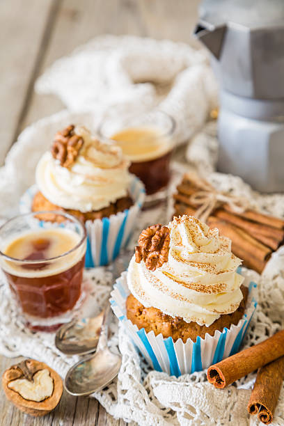 Three home made carrot cupcakes on white background
