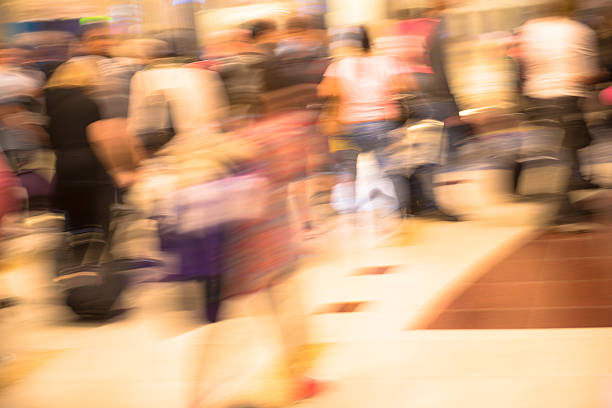 istock Large Group of Blurred People Walking, Dubai, UAE 592007382