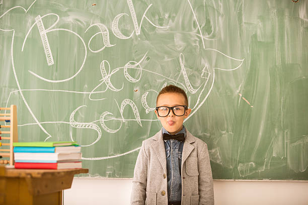 istock Schoolboy sticking his tongue out 592007734