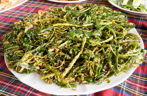 istock fried morning glory on a white plate, On the table. 592009480