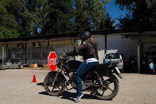 young lady at a mororcycle training course - driving training car safety imagens e fotografias de stock