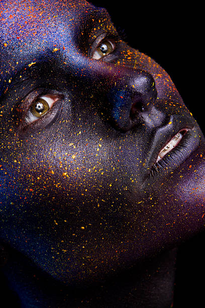 istock Glowing neon makeup with dramatic look in his eyes. 592011180