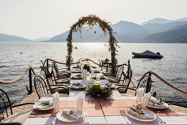 istock destination wedding arch and banqouet covered table at sunset 592016490