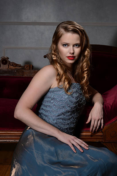 istock 1940s woman leaning on couch 592018042