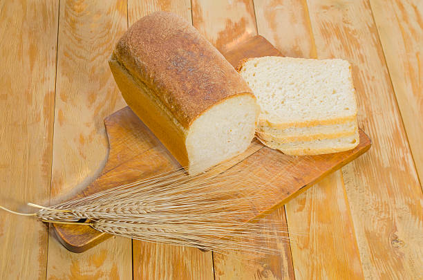 istock freshly baked bread on a wooden table outdoors 592021440