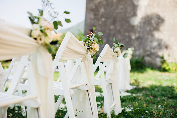 istock wedding chair cover with flowers decoration 592022320