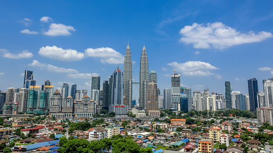 Kuala Lumpur, Malaysia - June 29, 2016: View of Kuala Lumpur city with iconic Petronas Twin Towers. Petronas Twin Towers also known as KLCC (Kuala Lumpur City Centre).
