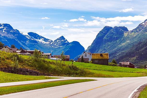 istock Norwegian Village and road in the mountains 592024996