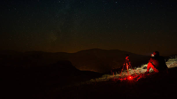 istock Silhouette of Photographer at Night 592026010