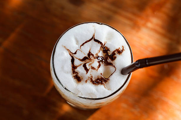 istock Ice cappuccino coffee on a wooden table 592026704
