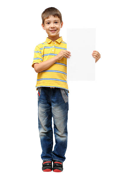 istock Boy holding blank poster isolated on white background 592027750
