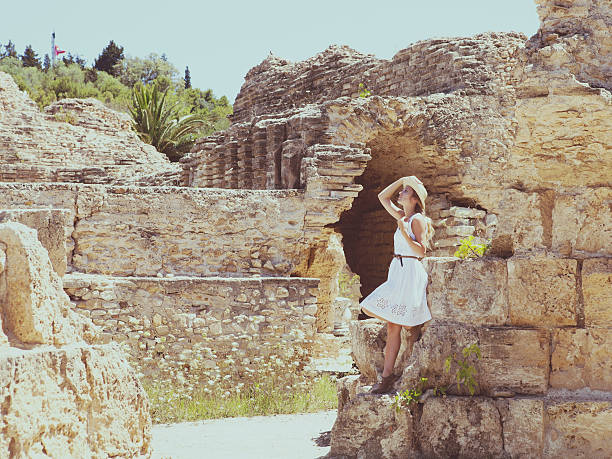 istock Woman traveler at ancient ruins Carthage 592028628