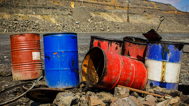 istock Empty metal barrels in the iron quarry 592029588