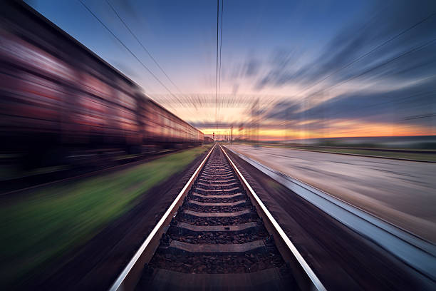 istock Railway station with cargo wagons in motion blur effect 592029600