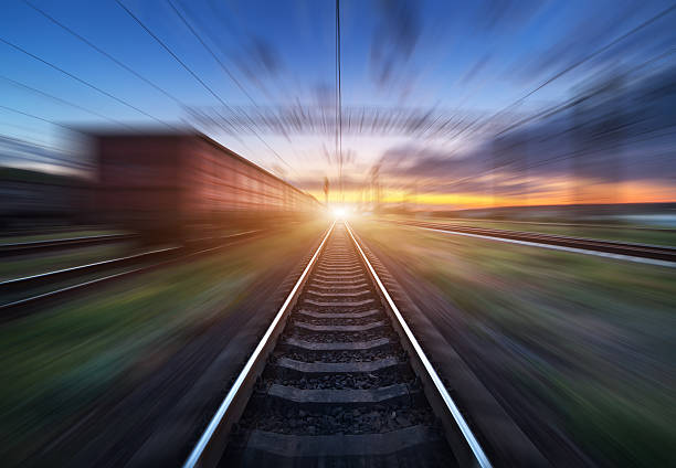 istock Railway station with cargo wagons in motion blur effect 592029678