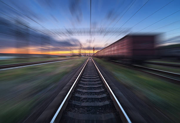istock Railway station with cargo wagons in motion blur effect 592029704