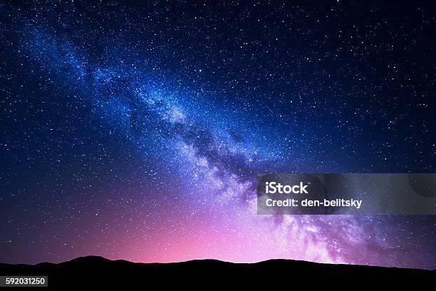 Milky Way And Pink Light At Mountains Night Colorful Landscape Stock Photo - Download Image Now