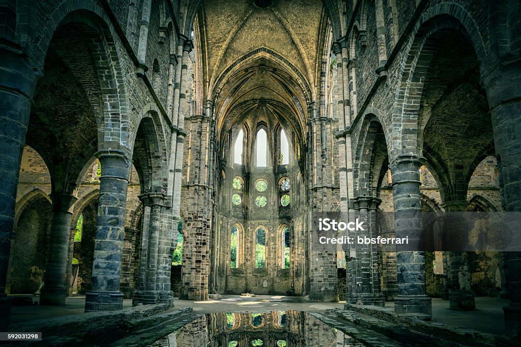 Dilapidated church in abandoned Villers Abbey Dilapidated church in abandoned Villers Abbey, Wallonia, Belgium (with dramatic light and HDR-effect) Church Stock Photo