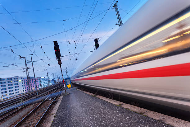 istock High speed passenger train on railroad track in motion 592031304