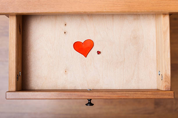 istock little and big red hearts in open drawer 592031970