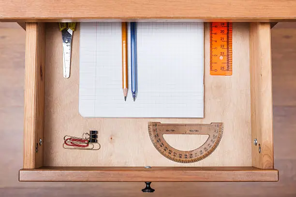 Photo of school set in open drawer