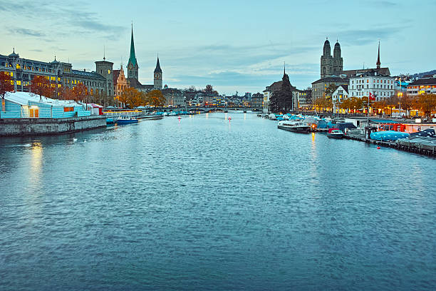 istock Sunset panorama of Zurich and reflection in Limmat River 592033470