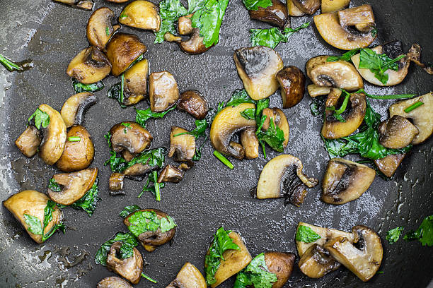 istock Detailed Top View on a Sauteed Brown and White Champignon 592035008