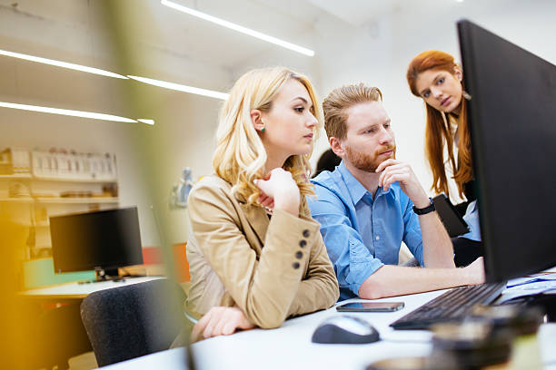 istock Designers working as a team in office 592035924