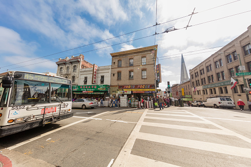 San Francisco, CA, USA - August 17, 2016: Jackson street is the main street for local residents daily shopping. A lot grocery stores and restaurants on the sides. Local residents and tourists walk on the street.