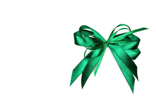 Beautiful green ribbon with bow isolated on white background.