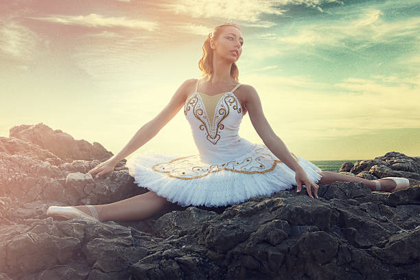 istock young ballerina making a splits on rocks 592357334