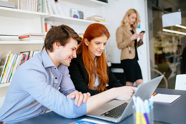 istock Business people brainstorming in office at desk 592357382