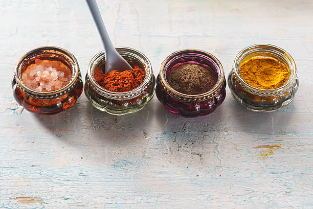 istock Colorful oriental spices on wooden table 592358048