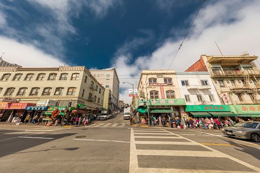 San Francisco, CA, USA - August 17, 2016: Jackson street is the main street for local residents daily shopping. A lot grocery stores and restaurants on the sides. Local residents and tourists walk on the street.