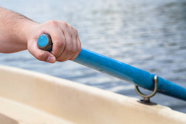 istock rower's hand holding oar close up 592358846