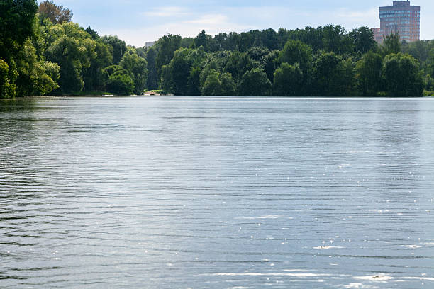 istock light rain on city pond in summer evening 592358958