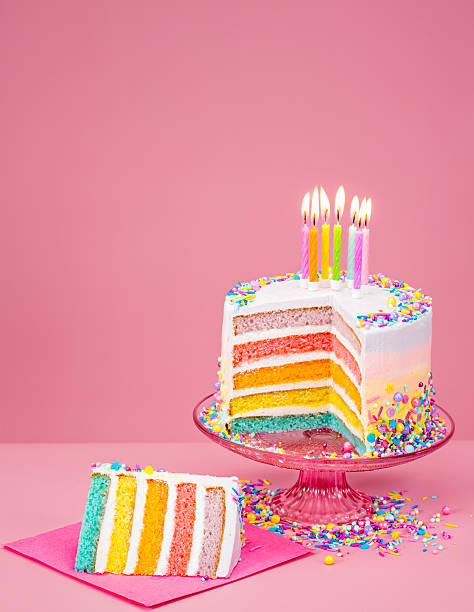 istock Colorful Birthday Cake over pink 592359466