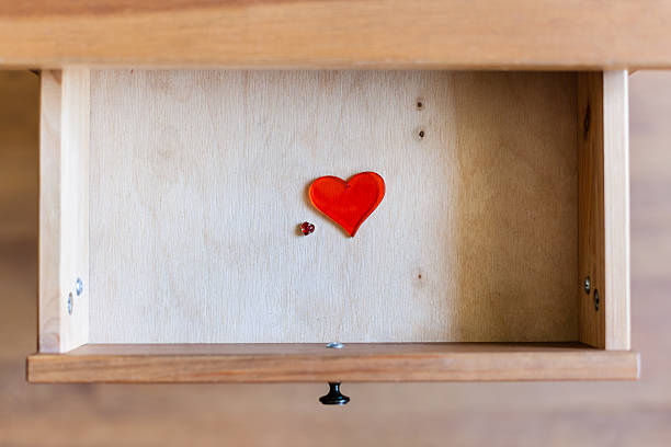 istock little and big glass hearts in open drawer 592360224