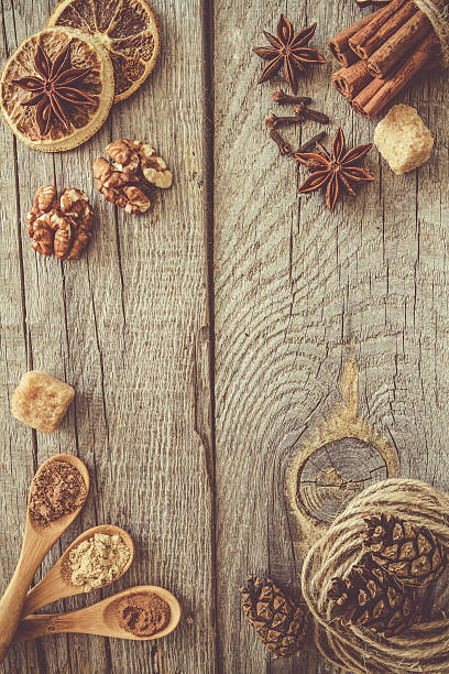 istock Selection of christmas spices on rustic wood background 592361796