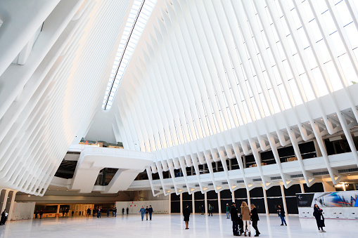 New York, NY, USA - March 22, 2016: Inside of World Trade Center Transportation Hub: The World Trade Center Transportation Hub is the Port Authority of New York and New Jersey's name for the new PATH. People see huge white Hall. 