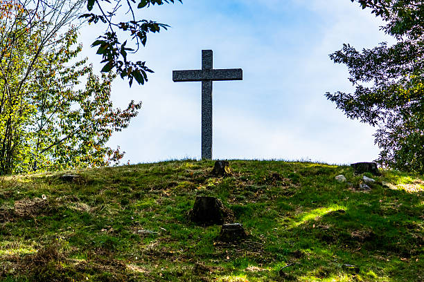 istock Low Angle View Of Cross On Field Against Sky 592362945